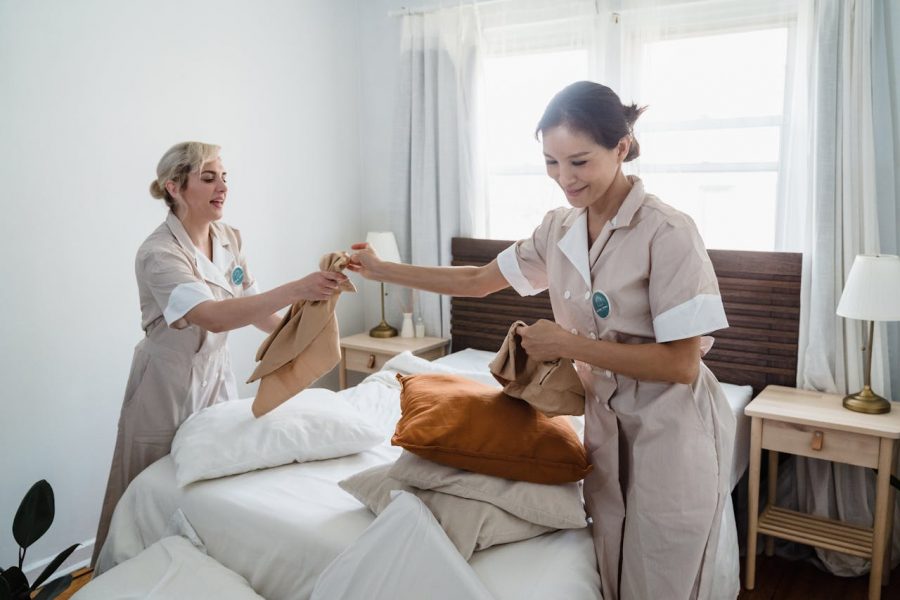 Housekeepers Changing Bed Sheets